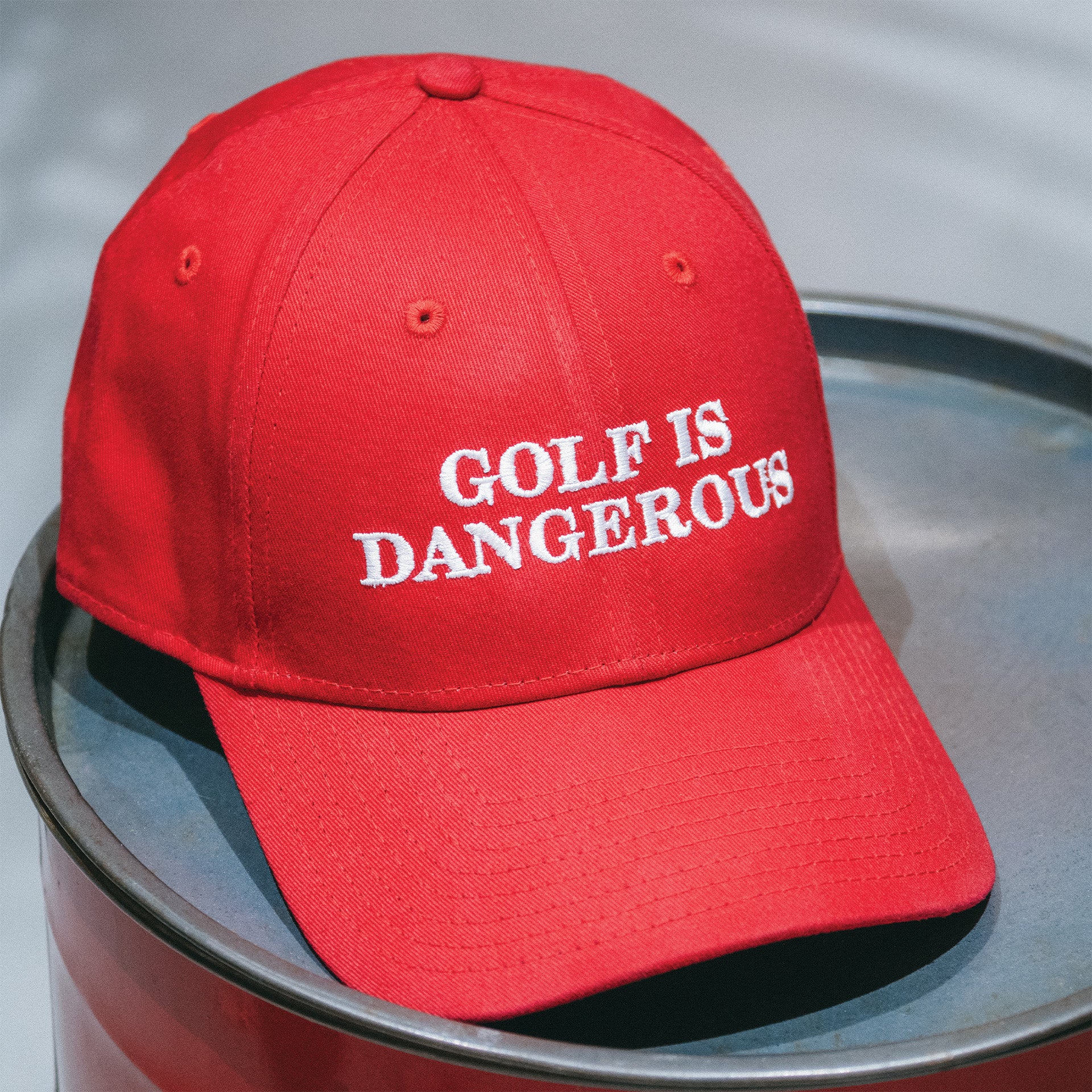 THE "GOLF IS DANGEROUS" BASEBALL CAP